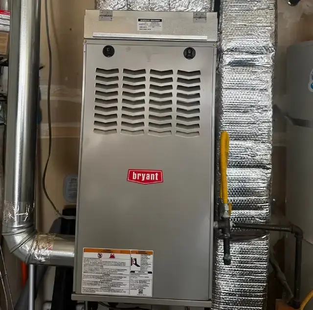 Technician preparing furnace replacement in Reno